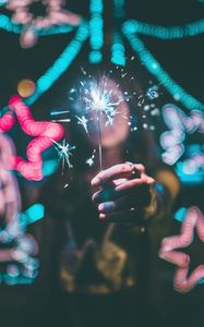 Preview wallpaper sparkler, hand, glare, neon, glitter, sparks