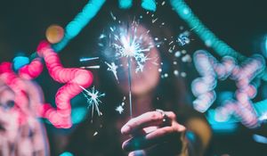 Preview wallpaper sparkler, hand, glare, neon, glitter, sparks