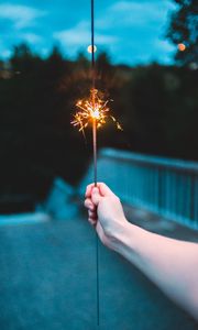 Preview wallpaper sparkler, hand, sparks, focus