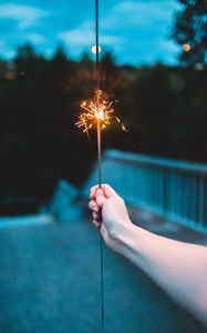 Preview wallpaper sparkler, hand, sparks, focus