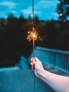 Preview wallpaper sparkler, hand, sparks, focus