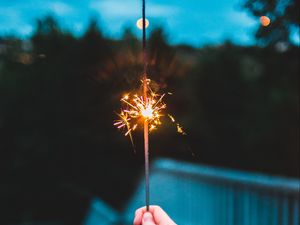 Preview wallpaper sparkler, hand, sparks, focus