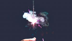 Preview wallpaper sparkler, spark, smoke, hand, dark