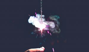 Preview wallpaper sparkler, spark, smoke, hand, dark