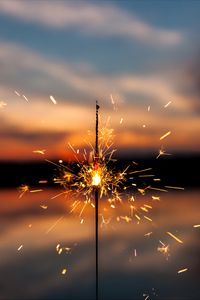 Preview wallpaper sparkler, sparks, blur, sunset