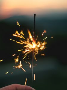 Preview wallpaper sparkler, sparks, hand, focus