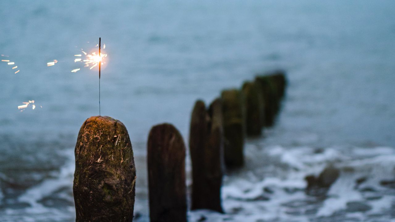 Wallpaper sparkler, sparks, sea, stones