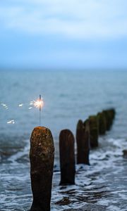 Preview wallpaper sparkler, sparks, sea, stones