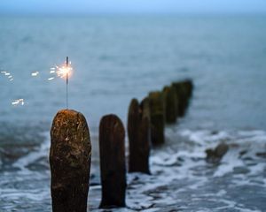 Preview wallpaper sparkler, sparks, sea, stones