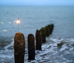 Preview wallpaper sparkler, sparks, sea, stones