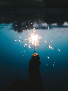 Preview wallpaper sparklers, hand, sparks, bright, twilight