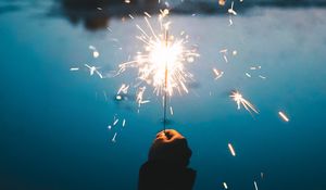 Preview wallpaper sparklers, hand, sparks, bright, twilight