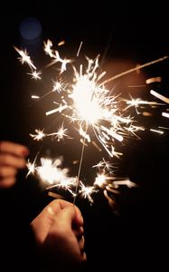 Preview wallpaper sparklers, hand, sparks, glow, dark