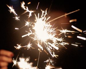 Preview wallpaper sparklers, hand, sparks, glow, dark