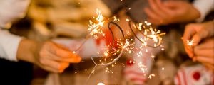 Preview wallpaper sparklers, sparks, candle, people, holiday