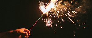 Preview wallpaper sparklers, sparks, hand, black