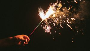 Preview wallpaper sparklers, sparks, hand, black