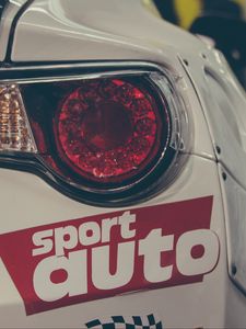 Preview wallpaper sports car, lights, sticker, inscription