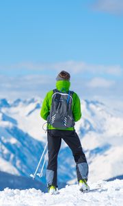 Preview wallpaper sportsman, skiing, mountain, top, tourist