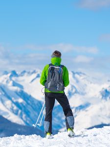 Preview wallpaper sportsman, skiing, mountain, top, tourist