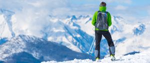 Preview wallpaper sportsman, skiing, mountain, top, tourist