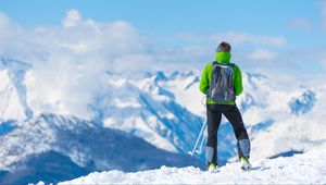 Preview wallpaper sportsman, skiing, mountain, top, tourist