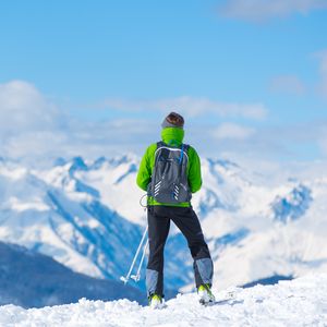 Preview wallpaper sportsman, skiing, mountain, top, tourist