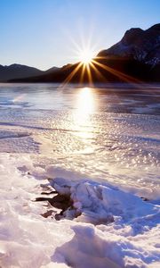 Preview wallpaper spring, thawing, snow, ice, water, lake, mountains, beams, heat