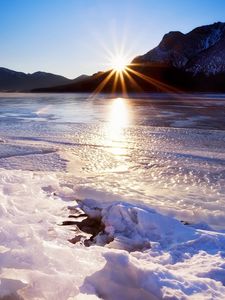 Preview wallpaper spring, thawing, snow, ice, water, lake, mountains, beams, heat