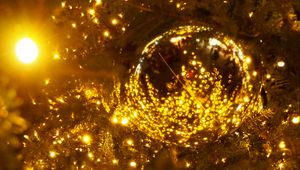 Preview wallpaper spruce, ball, branches, garland, glare, new year, christmas