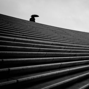 Preview wallpaper staircase, bw, umbrella, loneliness