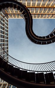 Preview wallpaper stairs, railings, windows, buildings, sky, bottom view