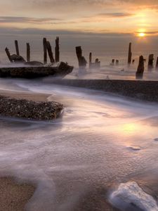 Preview wallpaper stakes, coast, foam, decline