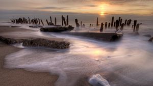 Preview wallpaper stakes, coast, foam, decline