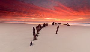 Preview wallpaper stakes, columns, sand, beach, outflow, evening, silence