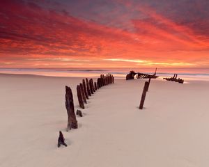 Preview wallpaper stakes, columns, sand, beach, outflow, evening, silence