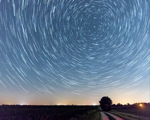 Preview wallpaper starry sky, freezelight, road, tree