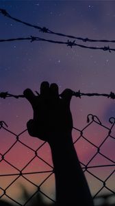 Preview wallpaper starry sky, hand, barbed wire, fence, freedom, night