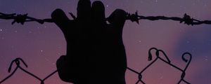 Preview wallpaper starry sky, hand, barbed wire, fence, freedom, night