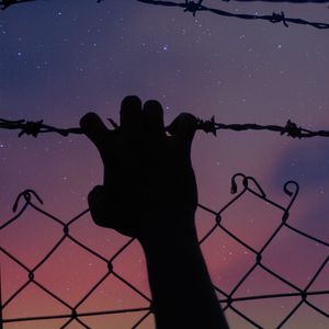 Preview wallpaper starry sky, hand, barbed wire, fence, freedom, night