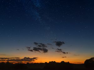 Preview wallpaper starry sky, horizon, sunset, night, clouds, landscape