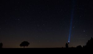 Preview wallpaper starry sky, man, lantern, night