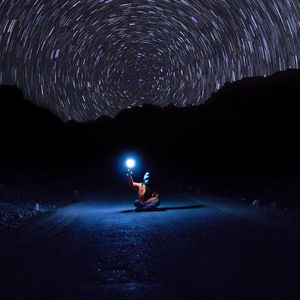 Preview wallpaper starry sky, man, night, light, road