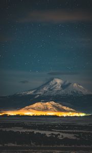 Preview wallpaper starry sky, mountain, snowy, night