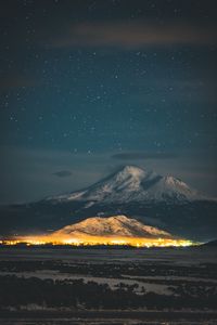Preview wallpaper starry sky, mountain, snowy, night