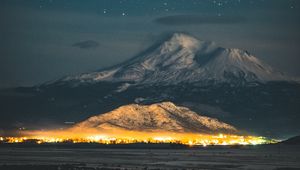 Preview wallpaper starry sky, mountain, snowy, night