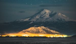 Preview wallpaper starry sky, mountain, snowy, night