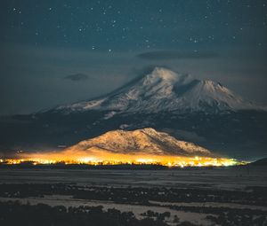 Preview wallpaper starry sky, mountain, snowy, night