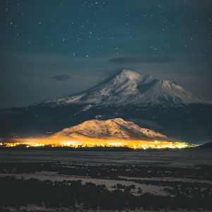 Preview wallpaper starry sky, mountain, snowy, night