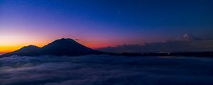 Preview wallpaper starry sky, mountains, clouds, night